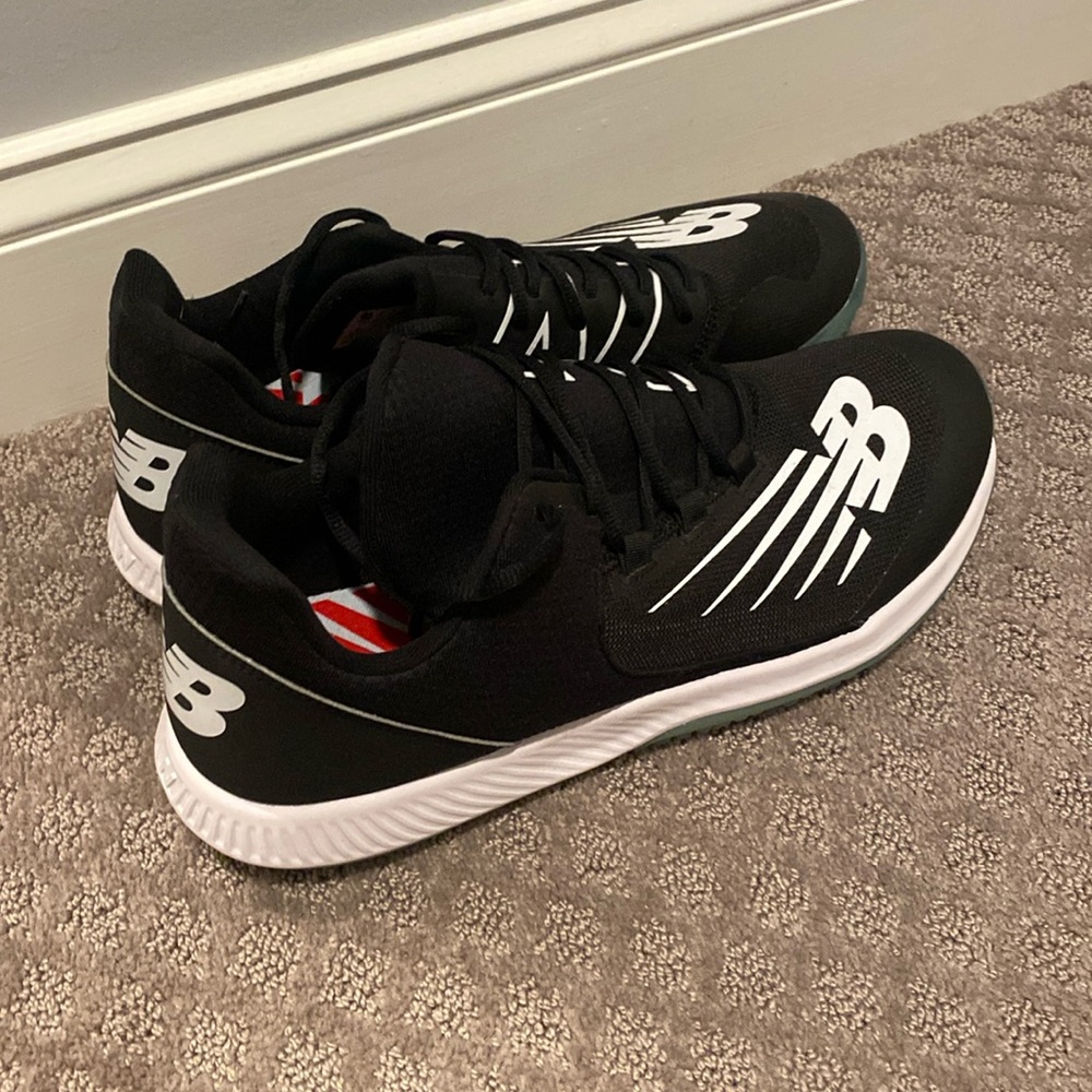 New balance baseball turf training shoes. Size 14. Black and white. Blue sole.